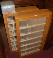 Lot 1483 - A pair of contemporary pear wood open CD racks,...