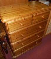 Lot 1485 - A modern pine round cornered chest of two...