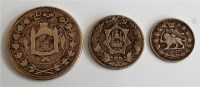 Lot 2152 - Three Middle Eastern silver coins, comprising;...
