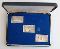 Lot 2207 - A cased set of three silver ingots, replicas...