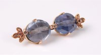 Lot 2506 - A two stone sapphire and diamond brooch, the...