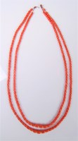 Lot 2507 - A two strand graduated coral bead necklace,...