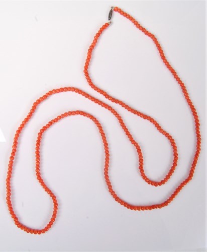 Lot 2508 - A coral bead necklace, the roughly uniform...