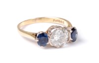 Lot 2509 - An 18ct diamond and sapphire ring, the round...