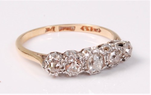 Lot 2512 - An 18ct five stone diamond ring, the five old...