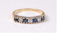 Lot 2514 - An 18ct sapphire and diamond ring, the seven...
