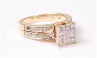 Lot 2520 - A diamond ring, the central raised calibre set...