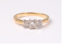 Lot 2534 - An 18ct three stone diamond ring, the three...