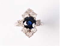 Lot 2535 - A sapphire and diamond cluster ring, the round...