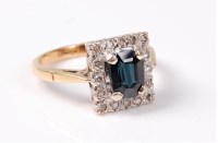 Lot 2537 - A sapphire and diamond cluster ring, the deep...