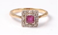 Lot 2543 - An 18ct ruby and diamond cluster ring, the...