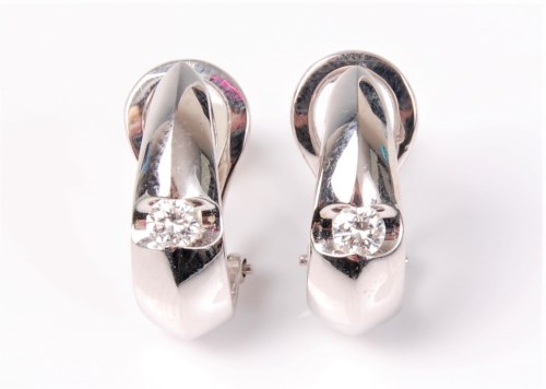 Lot 2550 - A pair of diamond earrings, the teardrop...