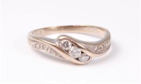 Lot 2555 - An 18ct three stone diamond ring, the three...