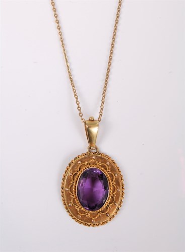 Lot 2558 - A late 19th century amethyst pendant, the oval...