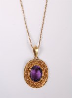 Lot 2558 - A late 19th century amethyst pendant, the oval...