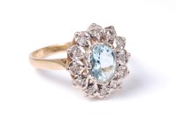 Lot 2559 - An 18ct aquamarine and diamond cluster ring,...