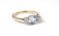 Lot 2566 - An 18ct aquamarine and diamond ring, the round...