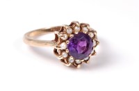 Lot 2568 - A 9ct amethyst and pearl ring, the round...