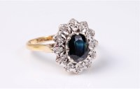Lot 2570 - An 18ct sapphire and diamond ring, the deep...