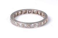 Lot 2571 - A diamond eternity ring, set with round...