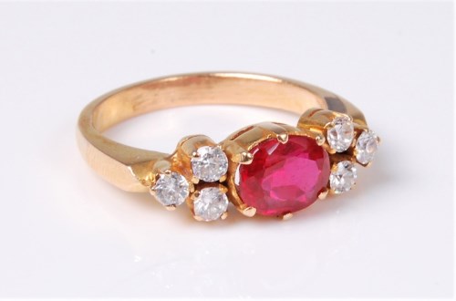 Lot 2572 - A synthetic ruby and white hardstone ring, the...