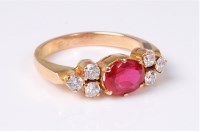 Lot 2572 - A synthetic ruby and white hardstone ring, the...