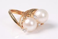 Lot 2580 - A pearl and diamond ring, the two...
