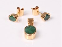 Lot 2581 - An emerald pendant and matching earrings, the...