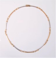 Lot 2584 - A bi-coloured 14ct gold necklace by Cetas, the...