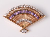 Lot 2599 - A hardstone fan brooch, the fan decorated with...