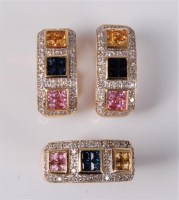 Lot 2612 - A pink, blue and yellow synthetic sapphire...