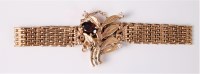 Lot 2618 - A 9ct garnet and diamond bracelet, oval garnet...