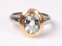Lot 2619 - A single stone aquamarine ring, the oval pale...