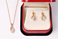 Lot 2630 - An 18ct diamond pendant and matching earrings,...