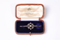 Lot 2633 - A 15ct pearl bar brooch, the three pearls with...