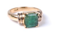 Lot 2636 - An emerald ring, the step cut emerald, approx....