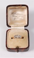 Lot 2647 - A three stone diamond ring, the three slightly...