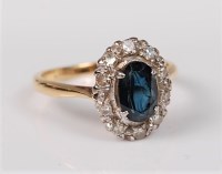 Lot 2655 - A sapphire and diamond ring, the oval deep...