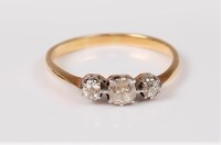 Lot 2659 - A three stone diamond ring, the central old...