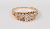 Lot 2660 - A two row diamond ring, the two rows of small...