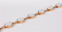 Lot 2669 - A 9ct opal bracelet, the thirteen oval opal...
