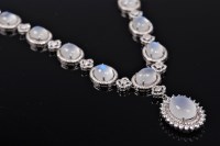 Lot 2674 - A moonstone and CZ necklace, the central drop...