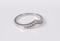 Lot 2675 - A 9ct white gold and diamond wishbone ring,...