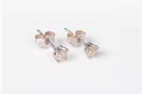Lot 2676 - A pair of 9ct white gold single stone earstuds,...