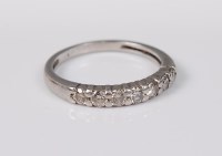 Lot 2677 - A diamond half hoop eternity ring, the round...