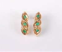 Lot 2680 - A pair of emerald earrings, the three small...