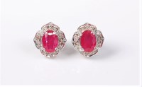 Lot 2682 - A pair of treated ruby and diamond earrings,...
