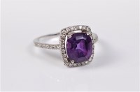 Lot 2690 - An 18ct white gold amethyst and diamond ring,...