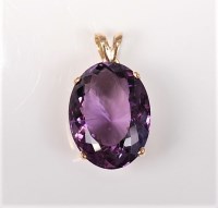 Lot 2693 - An amethyst pendant, the oval mixed cut...