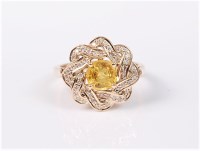 Lot 2696 - A 9ct yellow sapphire and diamond ring, the...